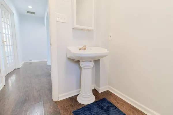 a bathroom with a sink and a mirror