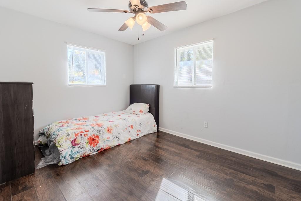 7583 Tyler Road Verona, PA 15147 - Photo 32 of 50 a bedroom with a bed and wooden floor
