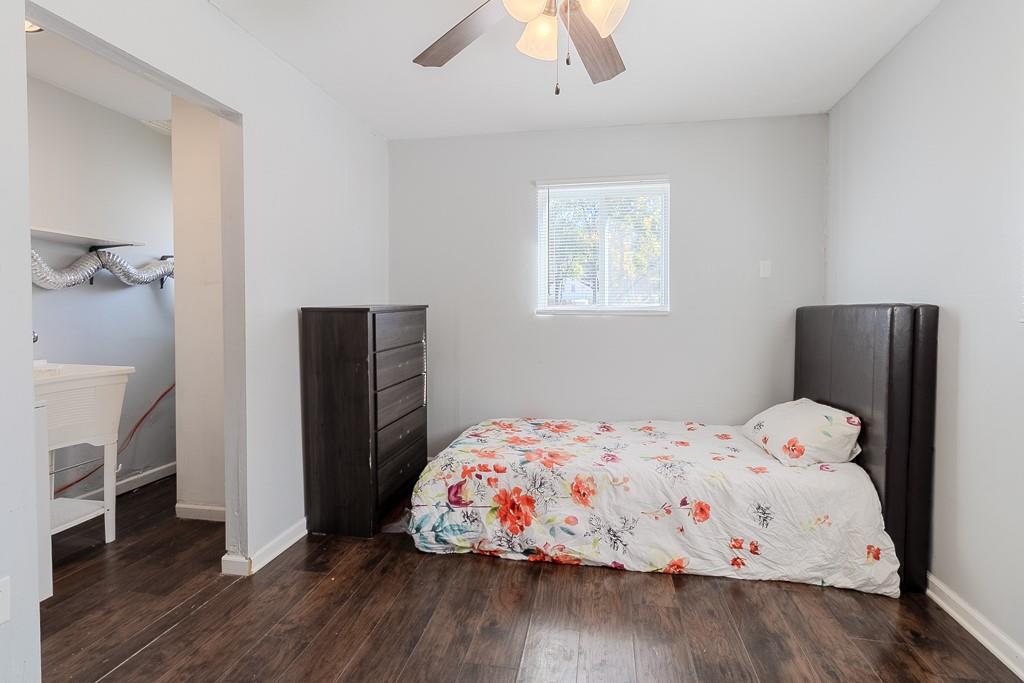 7583 Tyler Road Verona, PA 15147 - Photo 33 of 50 a bedroom with a bed and wooden floor