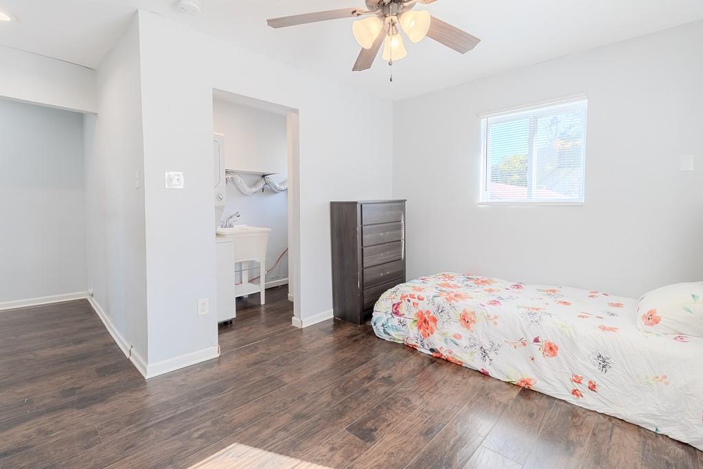 7583 Tyler Road Verona, PA 15147 - Photo 34 of 50 a bedroom with a bed and wooden floor