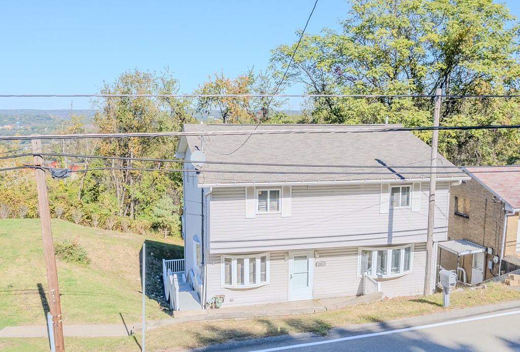 7583 Tyler Road Verona, PA 15147 - Photo 47 of 50 a front view of a house with a yard