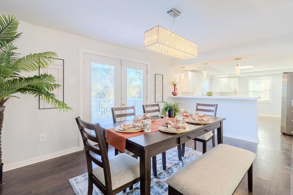 7583 Tyler Road Verona, PA 15147 - Photo 8 of 50 a view of a dining room with furniture window and wooden floor