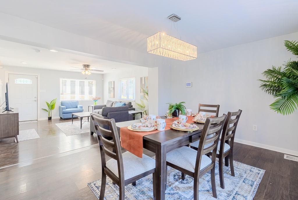 7583 Tyler Road Verona, PA 15147 - Photo 10 of 50 a view of a dining room with furniture and wooden floor