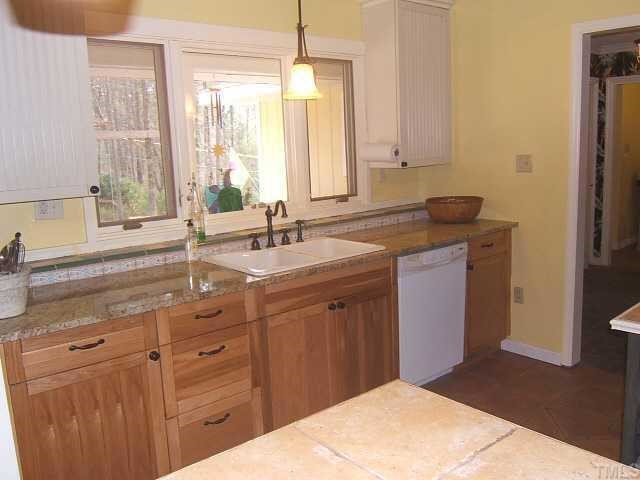1226 Lorimer Road Raleigh, NC 27606 - Photo 3 of 12 Updated Kitchen with granite & tile countertops and tile floor!