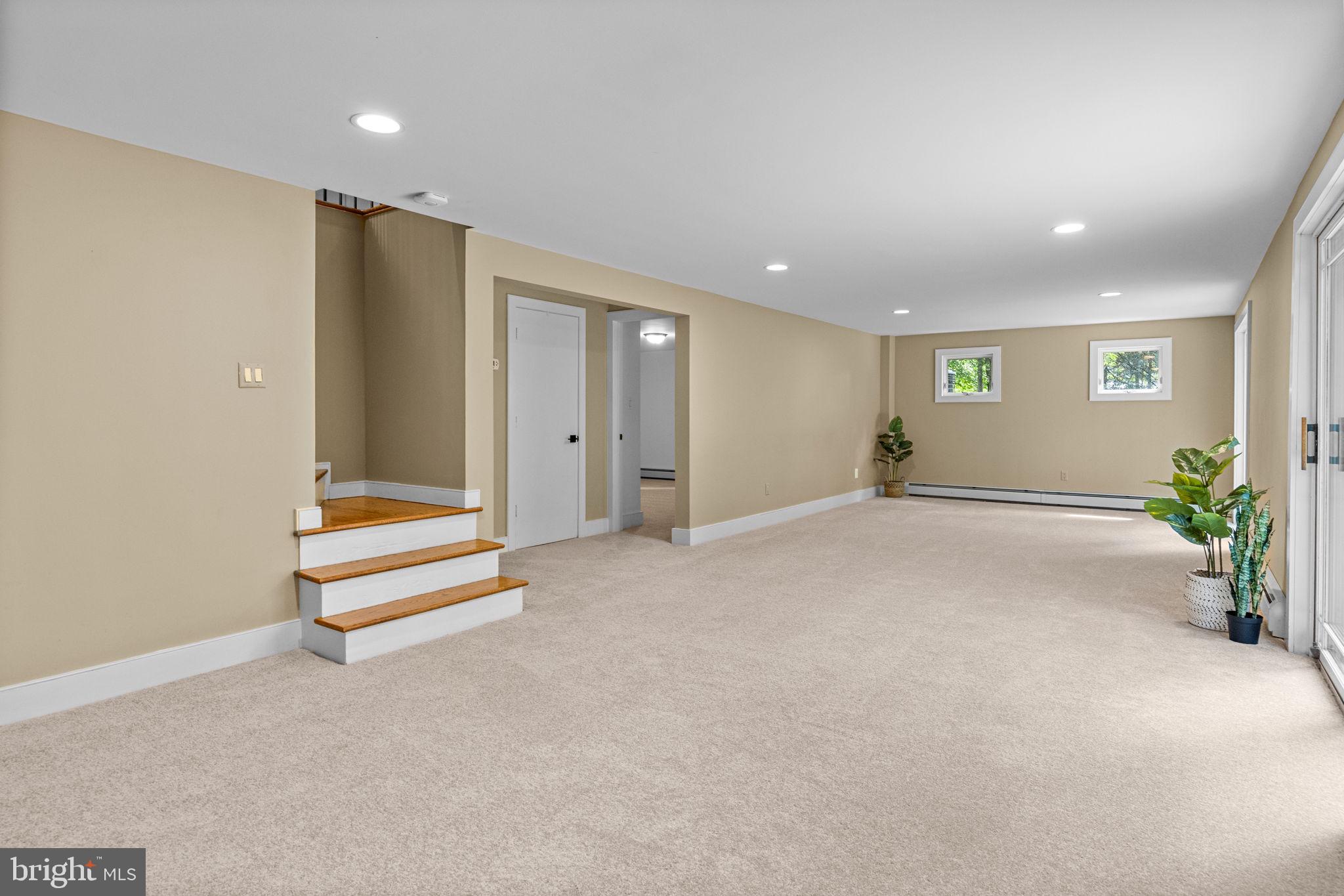 6975 Upper York Road New Hope, PA 18938 - Photo 30 of 61 Lower-level great room with new carpeting