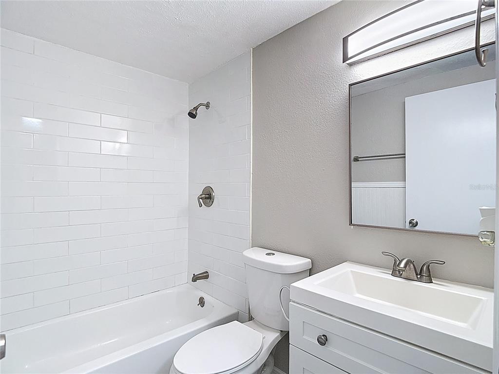 7827 Butler Avenue Hudson, FL 34667 - Photo 31 of 82 a bathroom with a sink toilet and shower