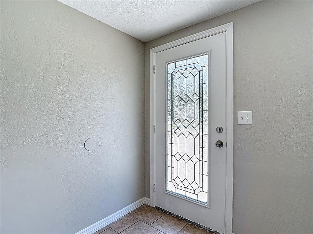 7827 Butler Avenue Hudson, FL 34667 - Photo 4 of 82 a view of an empty room with a window