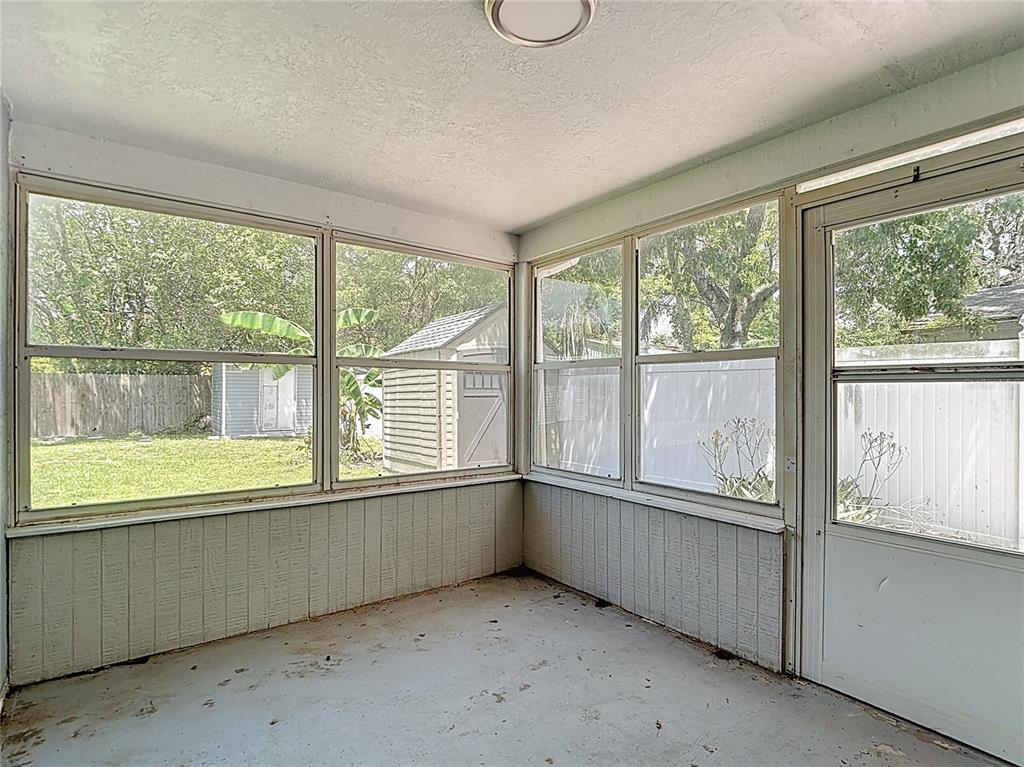 7827 Butler Avenue Hudson, FL 34667 - Photo 55 of 82 an empty room with wooden floor and windows