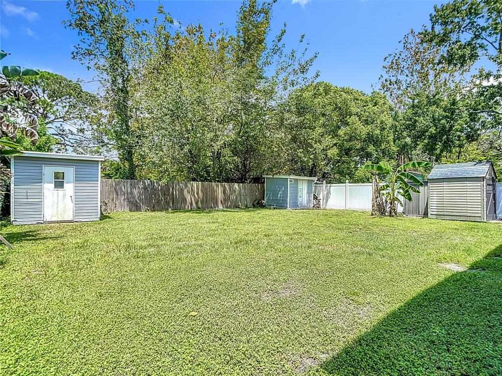 7827 Butler Avenue Hudson, FL 34667 - Photo 62 of 82 a view of a backyard with a tree