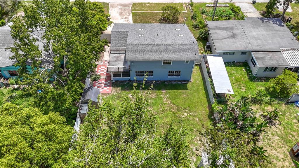 7827 Butler Avenue Hudson, FL 34667 - Photo 67 of 82 an aerial view of a house with swimming pool and garden