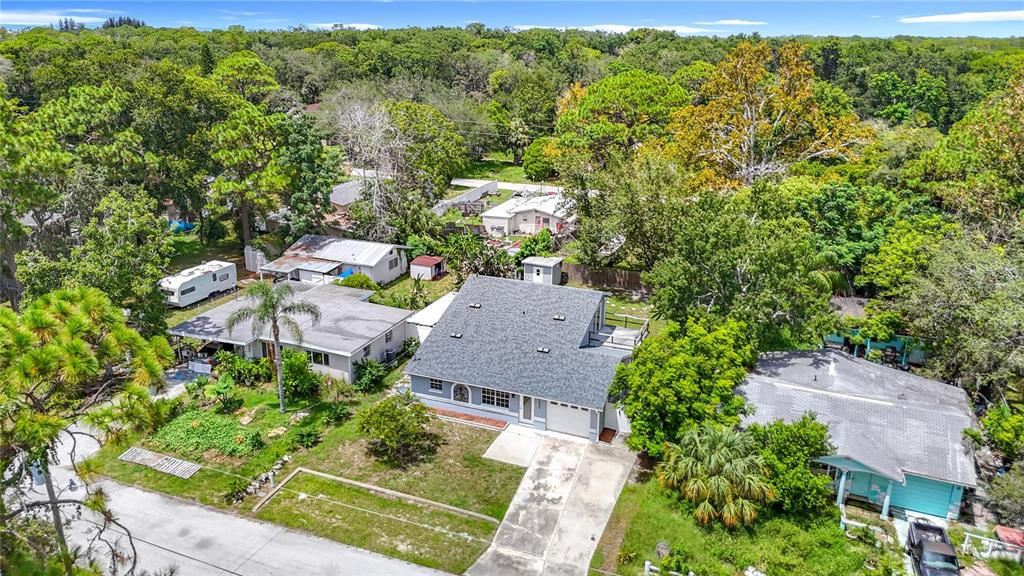 7827 Butler Avenue Hudson, FL 34667 - Photo 77 of 82 an aerial view of a house with a yard