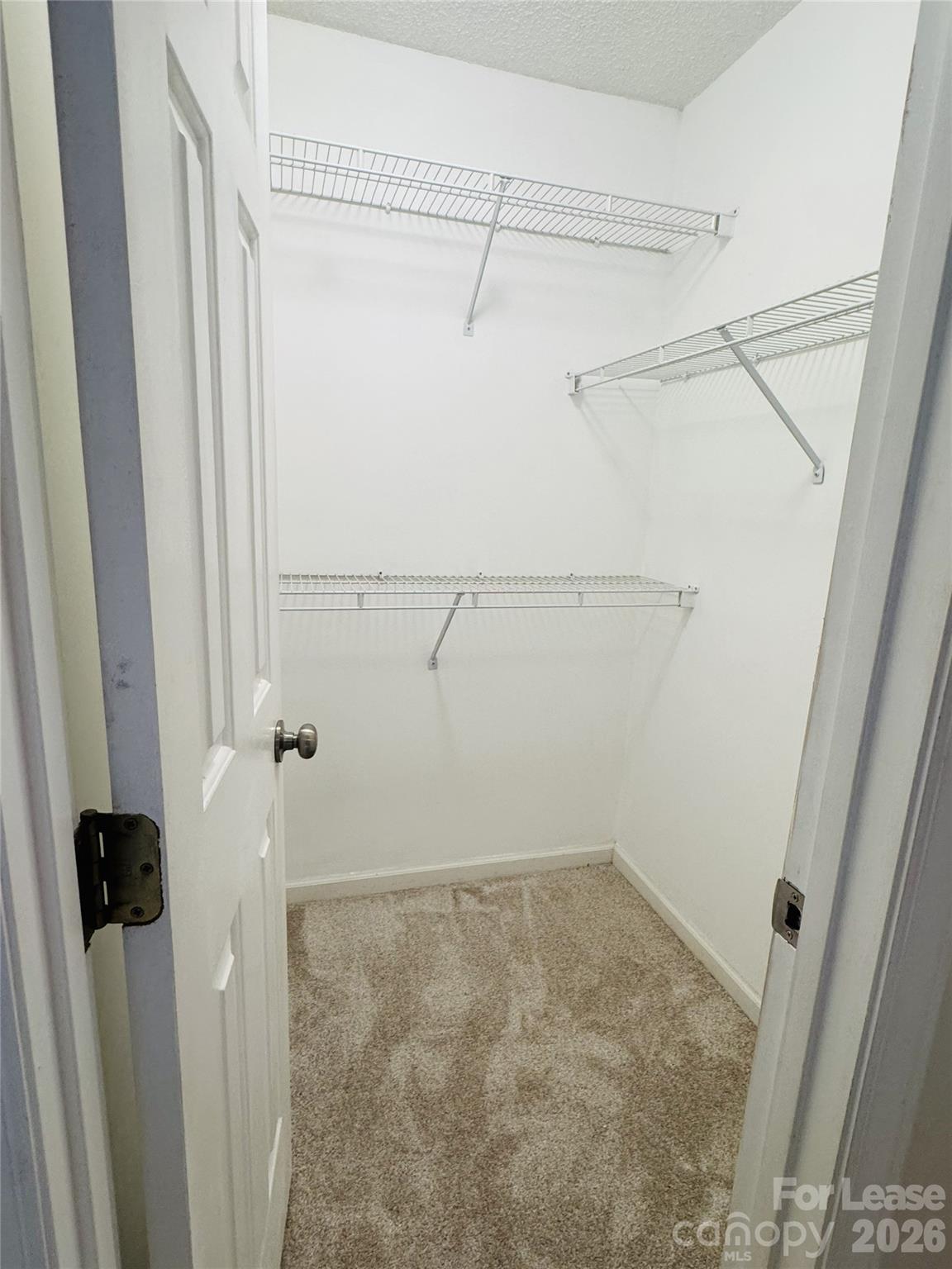 11408 Coreopsis Road Charlotte, NC 28213 - Photo 20 of 38 a view of a room with racks on the wall