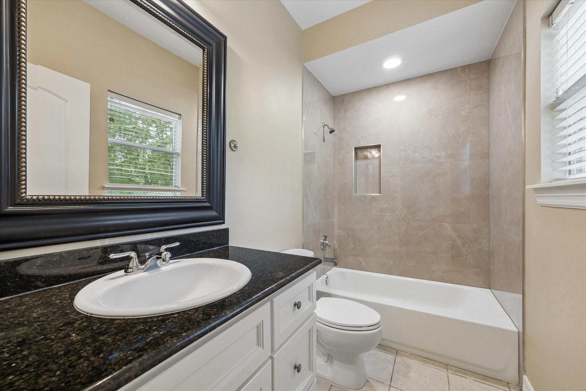 1417 Thompson Street Houston, TX 77007 - Photo 20 of 22 Secondary third floor bath, remodeled with matching tile from the primary