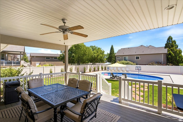 2973 West Red Sand Rd Haven Ogden, UT 84401 - Photo 2 of 30 Expansive outdoor living area featuring a covered deck with a ceiling fan, composite decking, and white railings