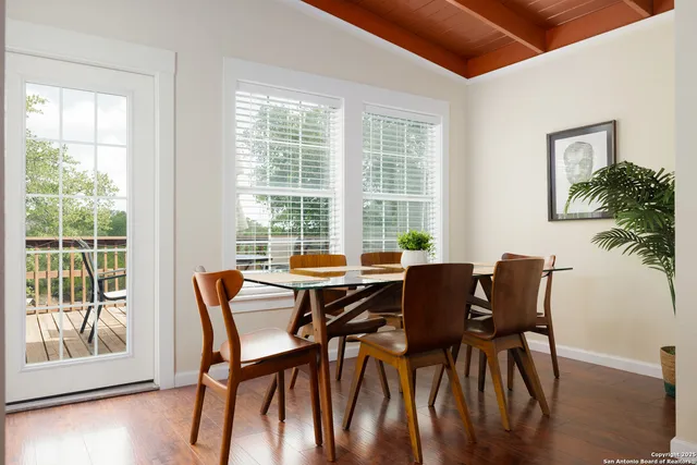 a view of a dining room with furniture window and wooden floor