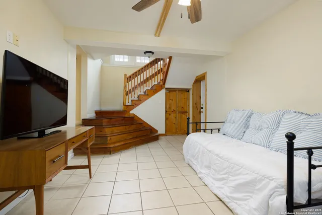 a living room with furniture and a flat screen tv