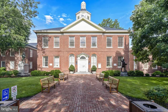 a front view of a building with garden