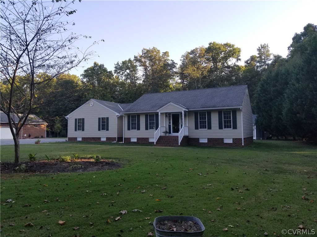 2057 Mill Road Henrico, VA 23231 - Photo 1 of 44 a front view of a house with garden