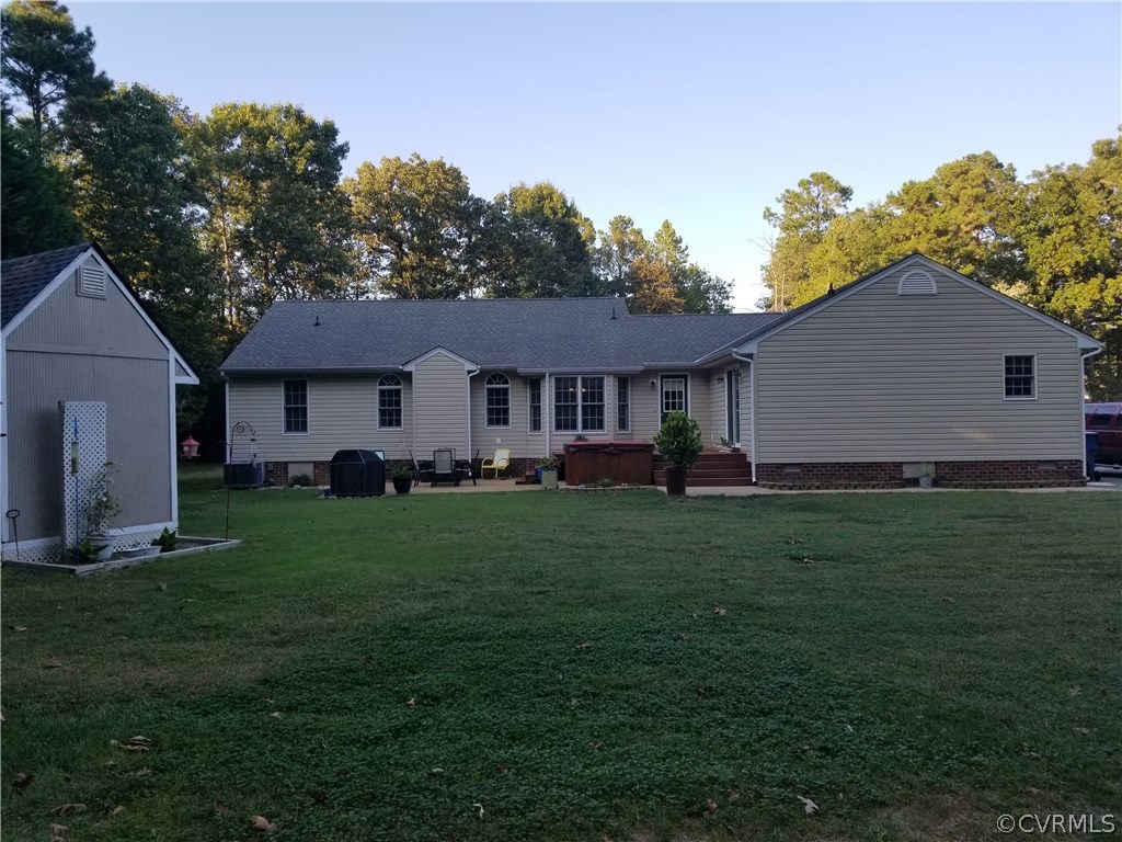 2057 Mill Road Henrico, VA 23231 - Photo 12 of 44 a view of a yard in front of a house with plants and large tree