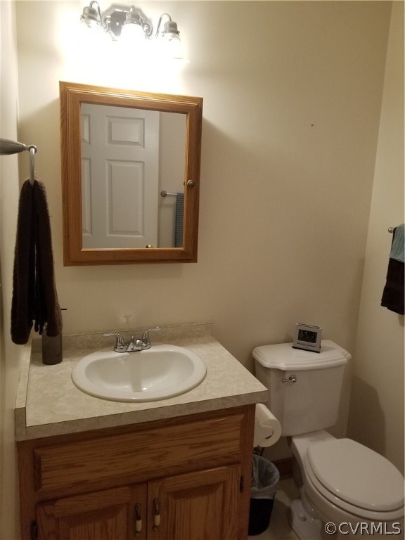 2057 Mill Road Henrico, VA 23231 - Photo 19 of 44 a bathroom with a sink a toilet and mirror