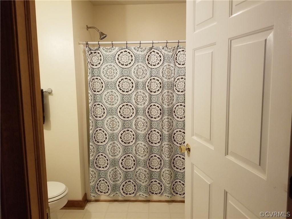 2057 Mill Road Henrico, VA 23231 - Photo 20 of 44 a bathroom with a shower curtain