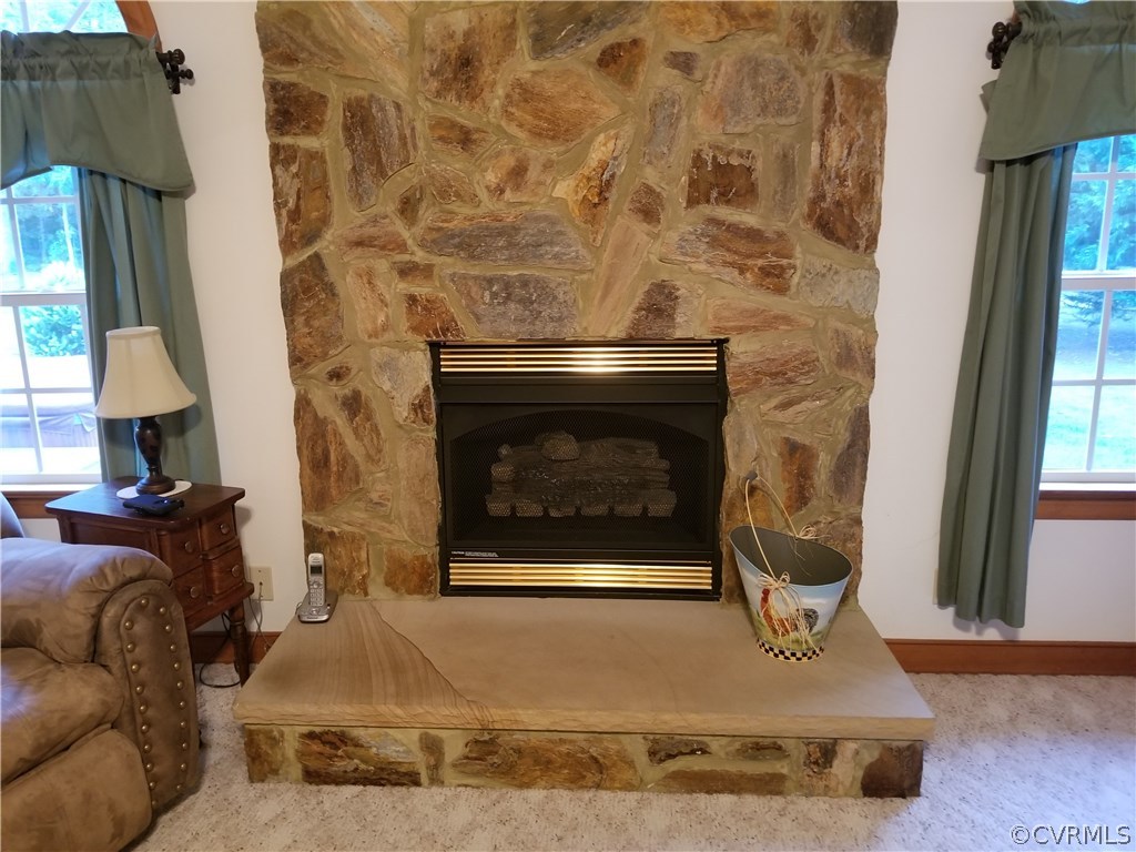 2057 Mill Road Henrico, VA 23231 - Photo 27 of 44 a living room with furniture and a fireplace