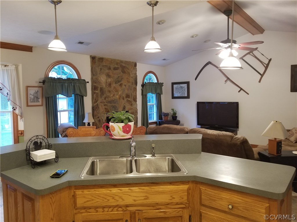 2057 Mill Road Henrico, VA 23231 - Photo 34 of 44 a view of living room with granite countertop furniture and a flat screen tv