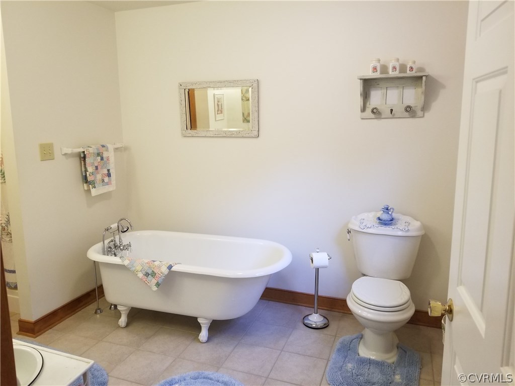 2057 Mill Road Henrico, VA 23231 - Photo 42 of 44 a bathroom with a toilet and a bathtub