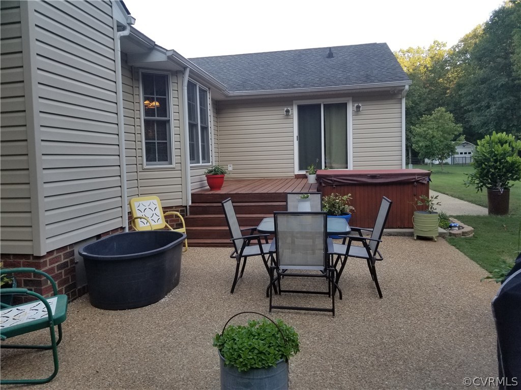 2057 Mill Road Henrico, VA 23231 - Photo 10 of 44 a view of backyard with outdoor seating a patio and a garden