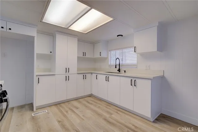a view of kitchen with wooden floor