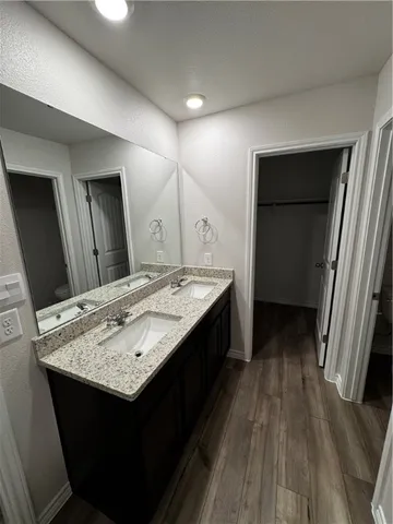 a bathroom with a sink a vanity and a mirror