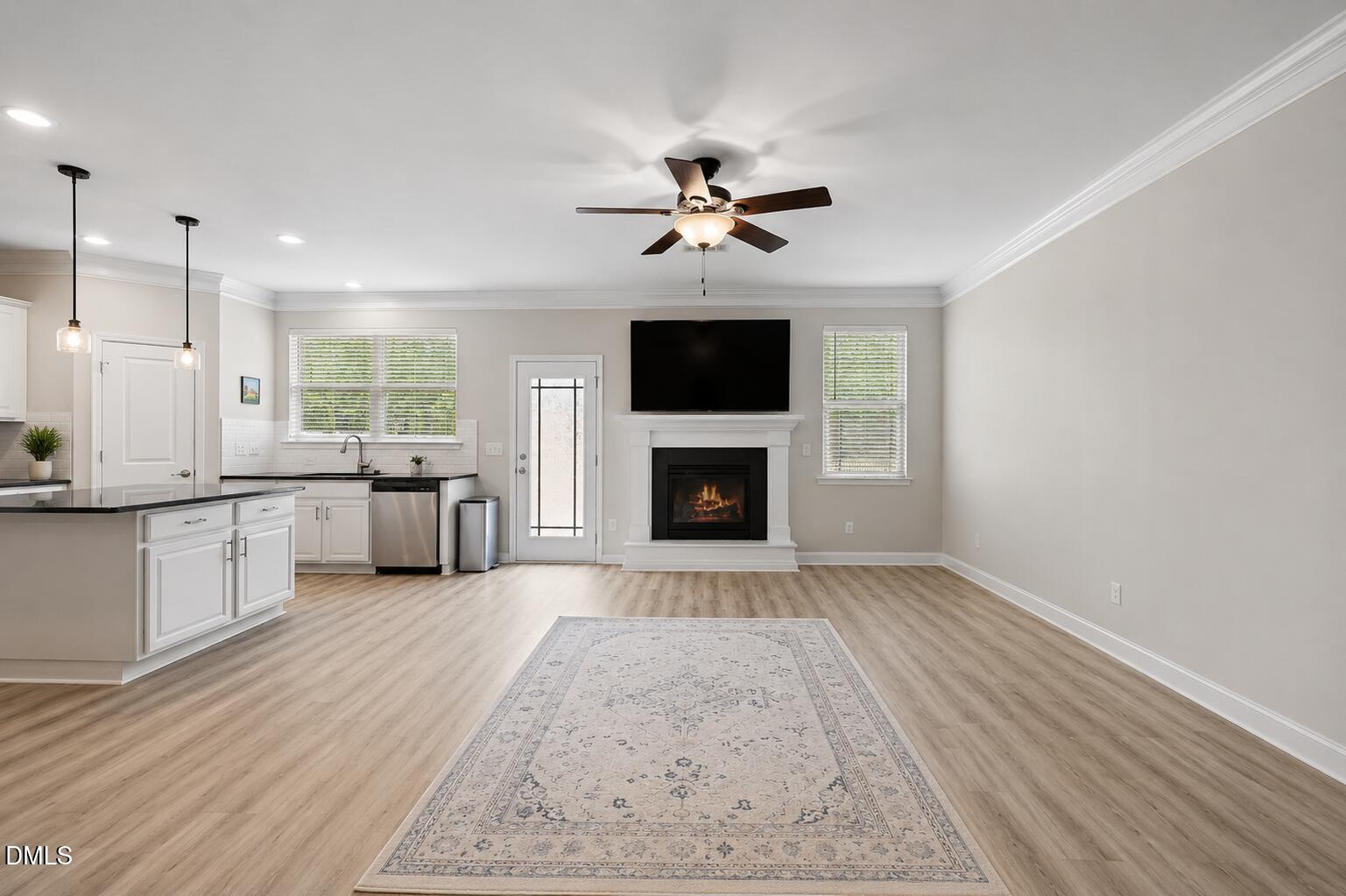 364 Springtime Fields Lane Wake Forest, NC 27587 - Photo 14 of 63 a view of a kitchen with a stove cabinets and wooden floor