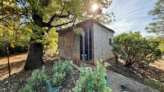 a backyard of a house with lots of green space