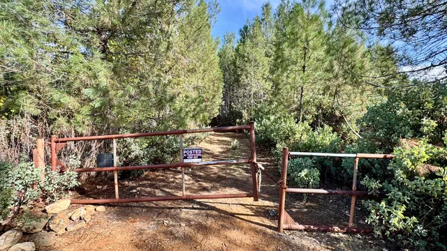 a view of outdoor space with wooden fence