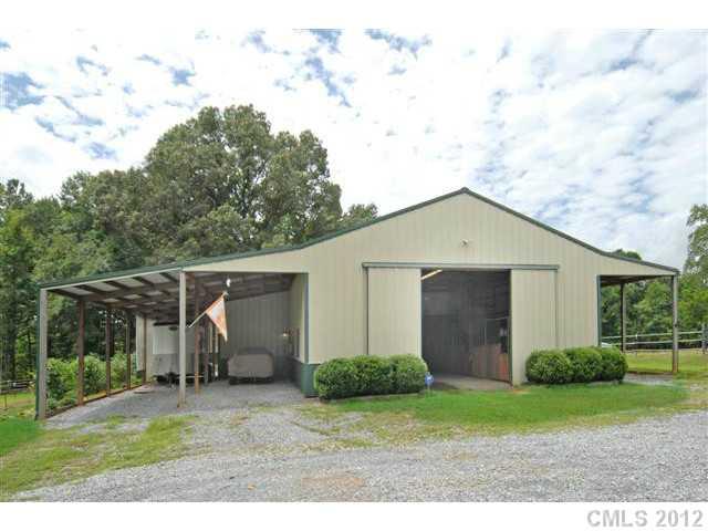 1139 State Rd S-46-27 Clover, SC 29710 - Photo 1 of 16 a backyard of a house with plants and barbeque oven