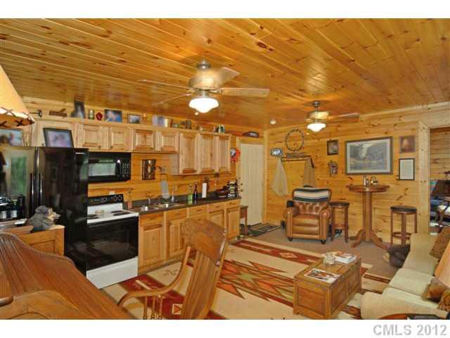 1139 State Rd S-46-27 Clover, SC 29710 - Photo 5 of 16 a kitchen with stainless steel appliances kitchen island granite countertop a stove and a microwave