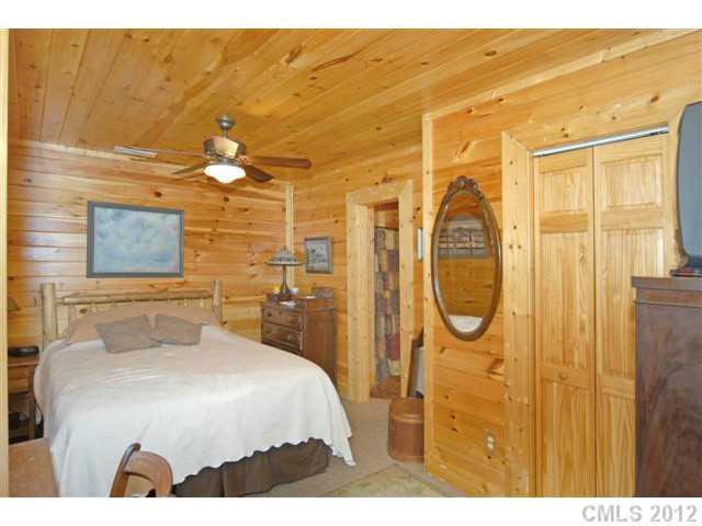 1139 State Rd S-46-27 Clover, SC 29710 - Photo 7 of 16 a bedroom with a bed and a chandelier
