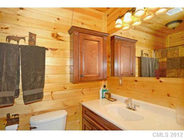 1139 State Rd S-46-27 Clover, SC 29710 - Photo 8 of 16 a bathroom with a sink and a mirror