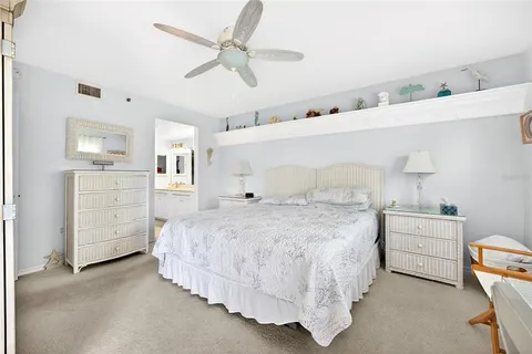 a bedroom with a bed and a cabinets