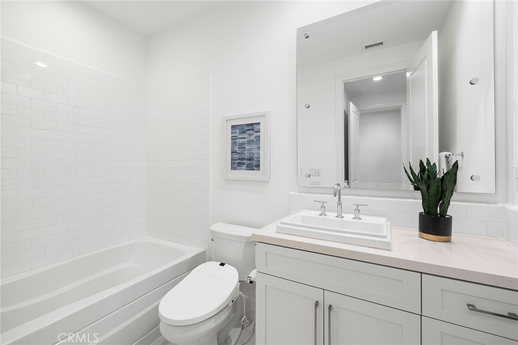 115 Treasure Irvine, CA 92602 - Photo 32 of 39 a bathroom with a sink a toilet and shower