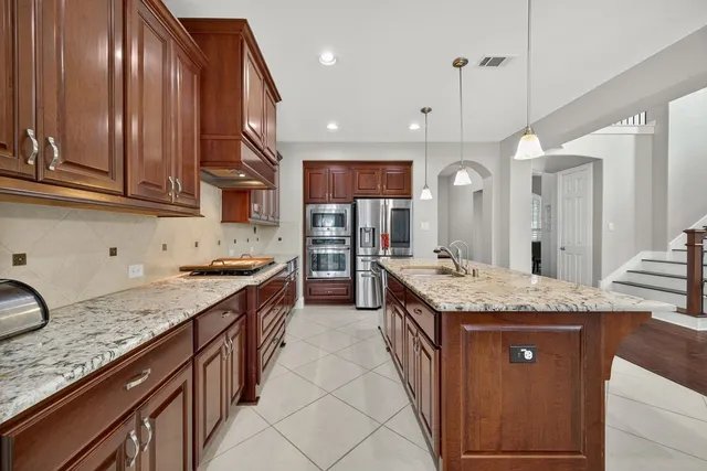 a living room with furniture and a kitchen view