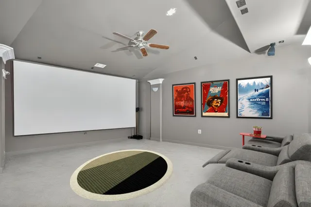 a living room with furniture pool table and a large window