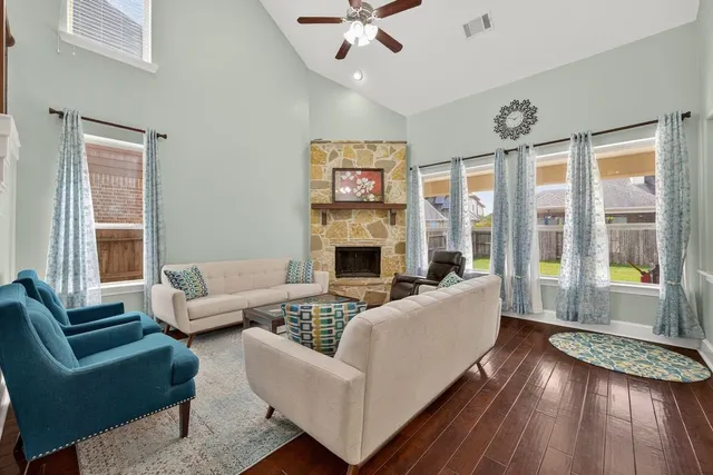 a living room with furniture and a fireplace