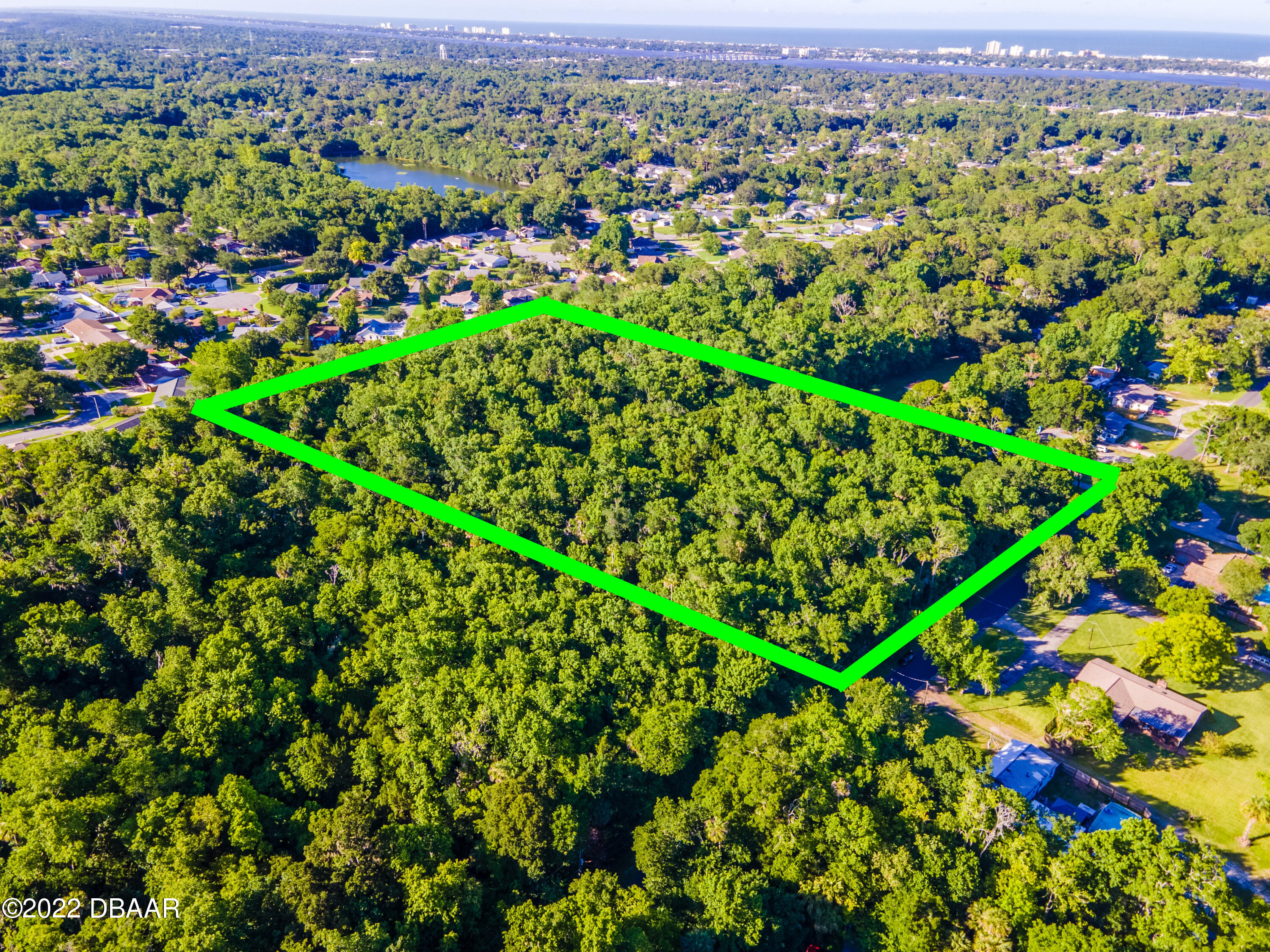 845 Arroyo Parkway Ormond Beach, FL 32174 - Photo 5 of 8 an aerial view of a houses with a yard