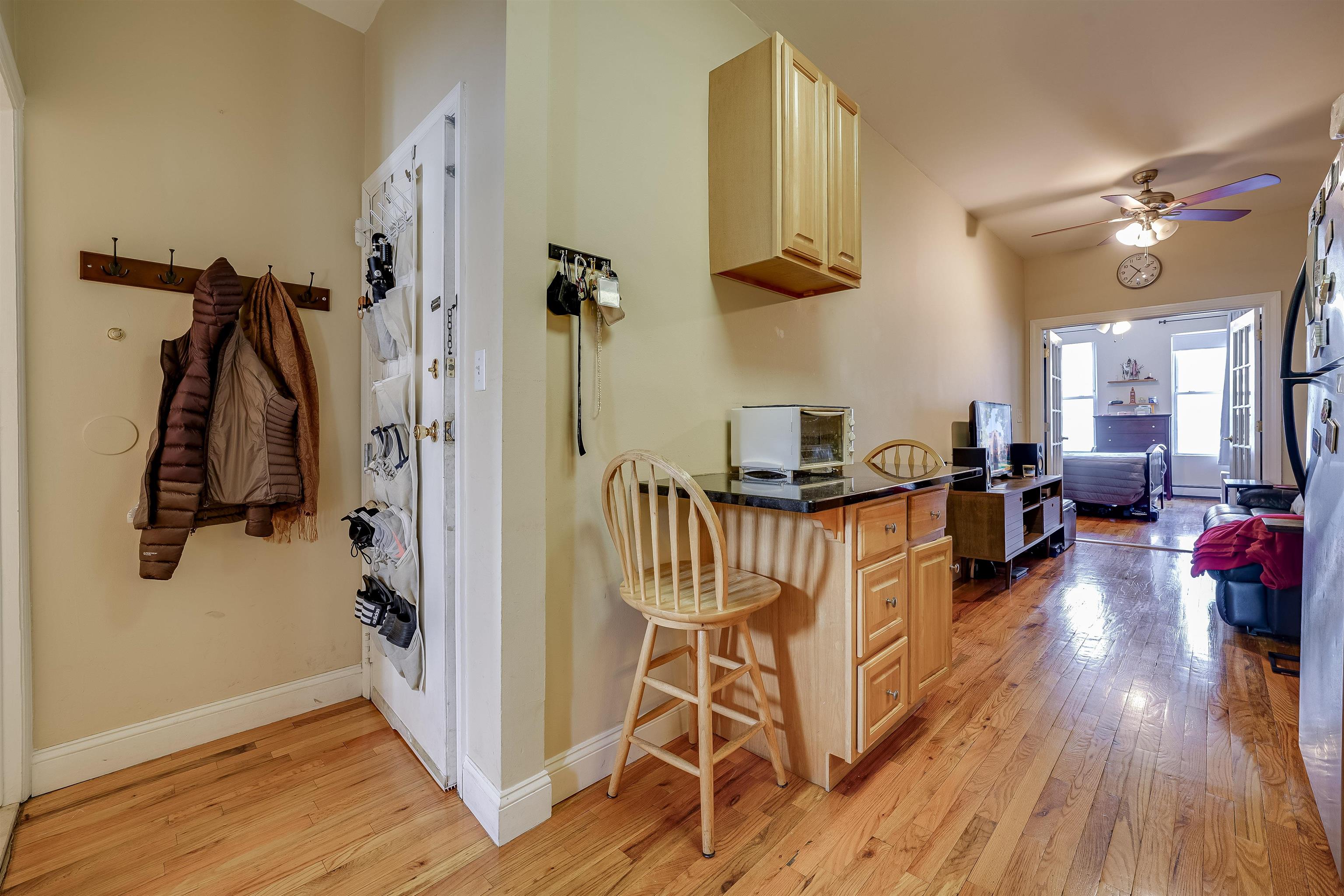 63 Madison Street, Unit 3 Hoboken, NJ 07030 - Photo 13 of 19 a living room with furniture and a wooden floor