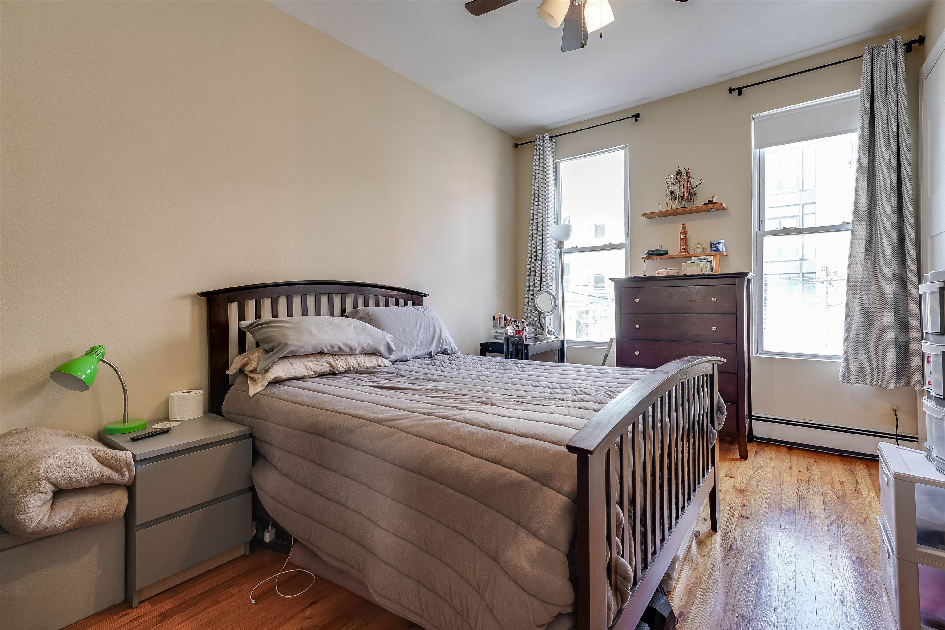 63 Madison Street, Unit 3 Hoboken, NJ 07030 - Photo 14 of 19 a bedroom with bed and wooden floor