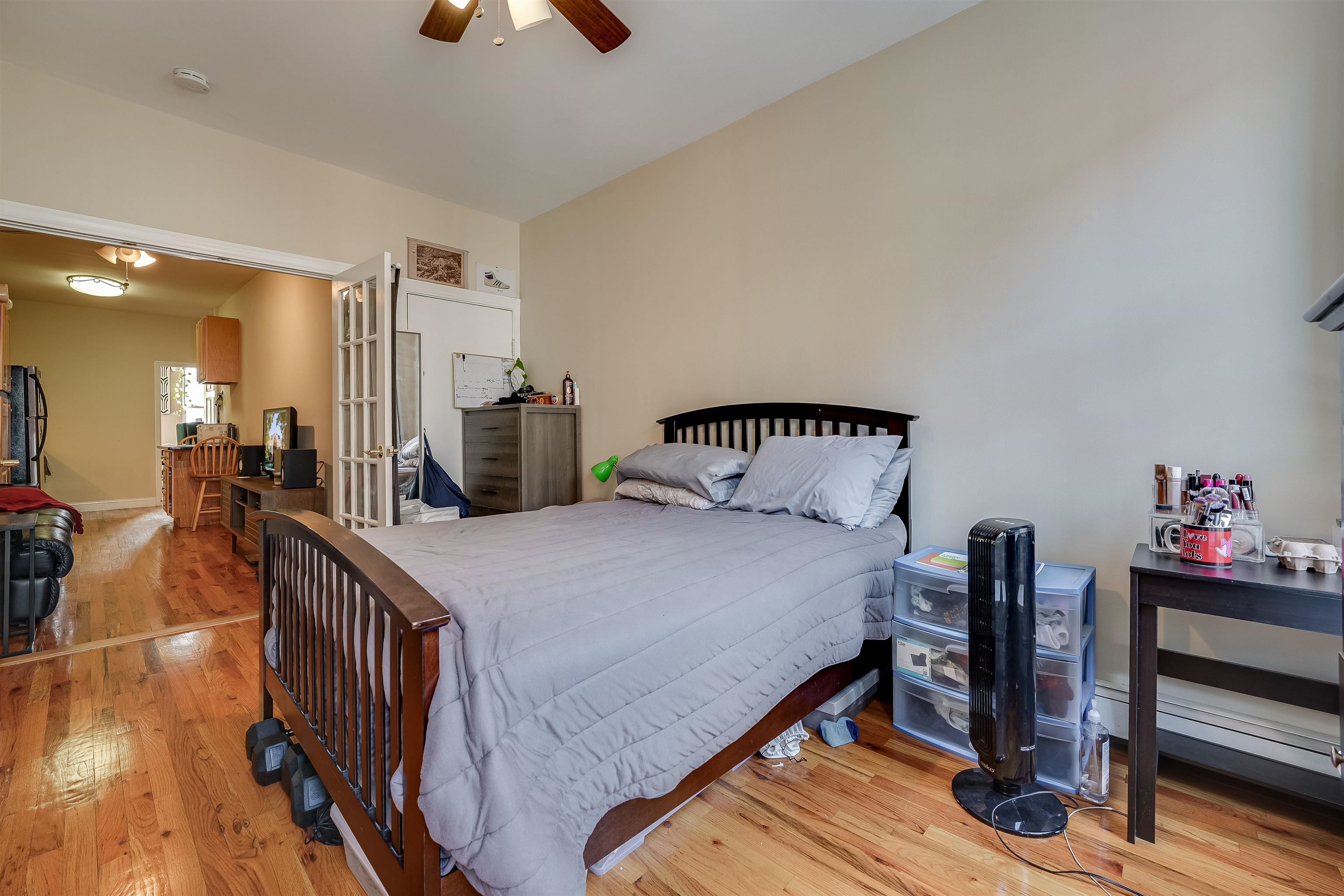 63 Madison Street, Unit 3 Hoboken, NJ 07030 - Photo 16 of 19 a bedroom with a bed and wooden floor