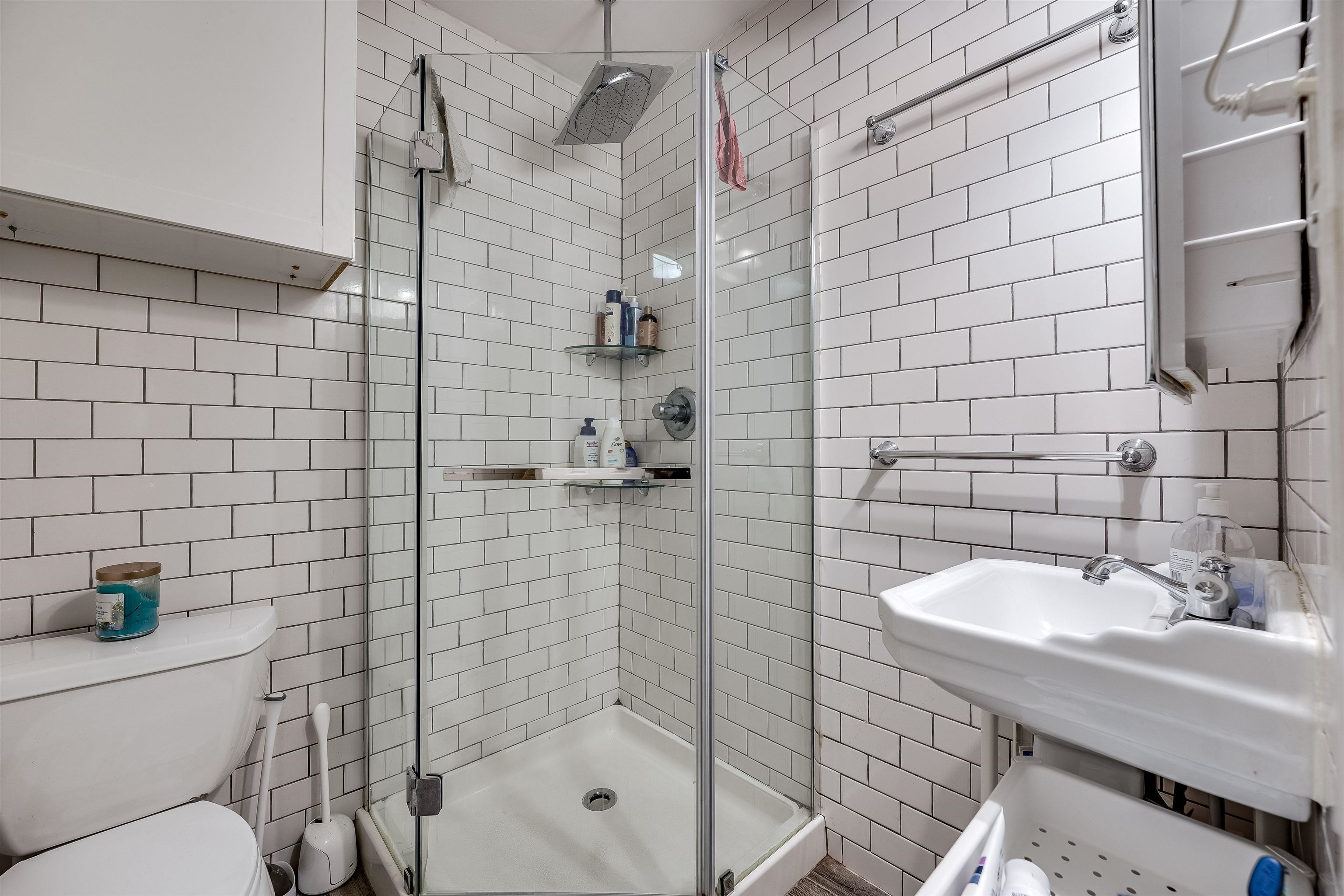 63 Madison Street, Unit 3 Hoboken, NJ 07030 - Photo 17 of 19 a bathroom with a sink toilet and shower