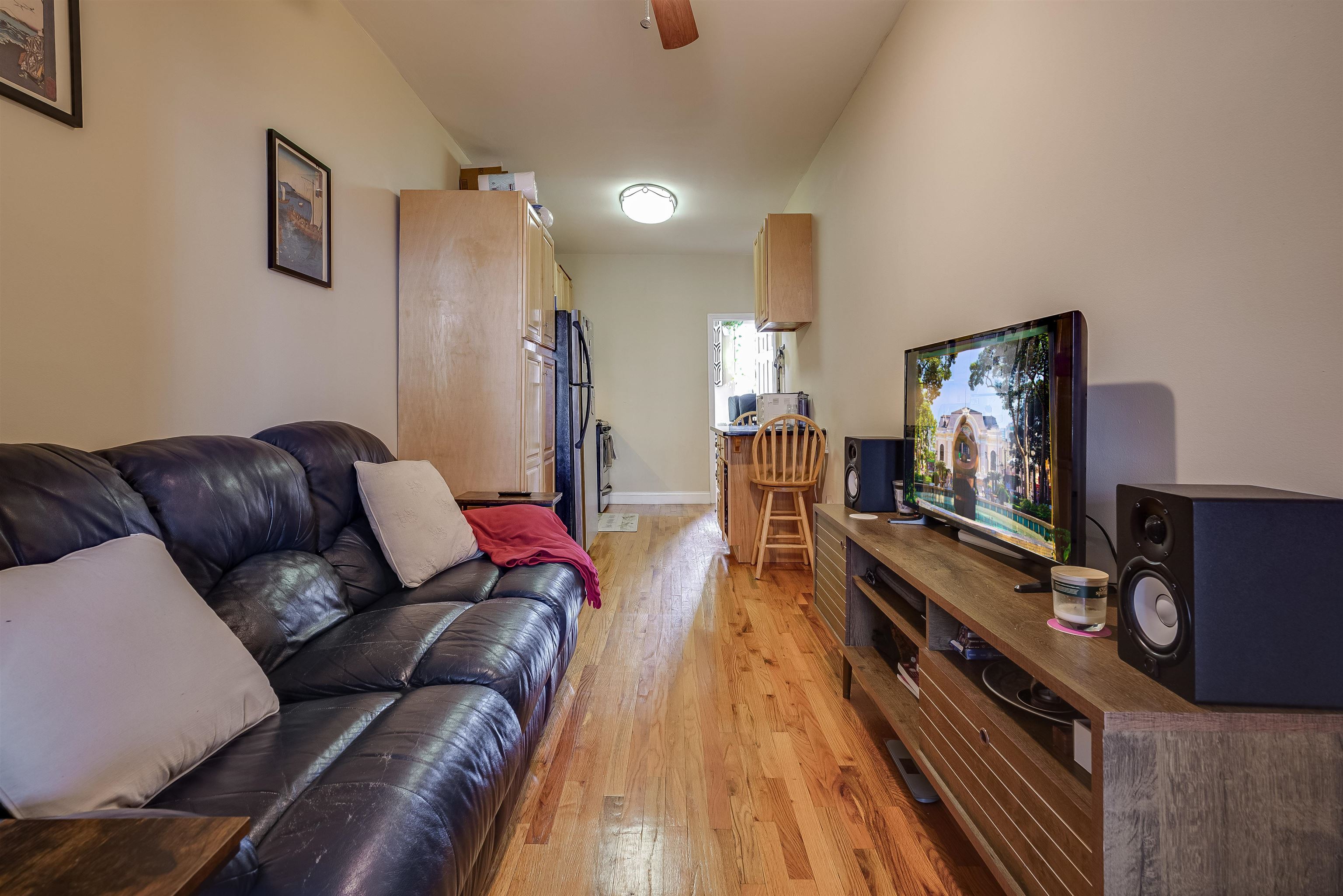 63 Madison Street, Unit 3 Hoboken, NJ 07030 - Photo 5 of 19 a living room with furniture and a flat screen tv