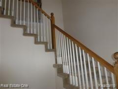 3385 Tremonte Circle, Unit 208 Rochester, MI 48306 - Photo 8 of 31 Curved Stairway